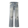 Blue men's straight-leg ripped jeans on a neutral background, showing zipper fly and cotton blend fabric texture.