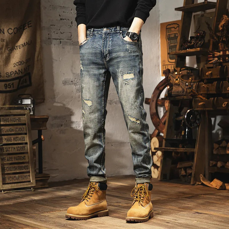 Man wearing vintage blue loose-fit jeans with a fleece lining and drawstring waist.