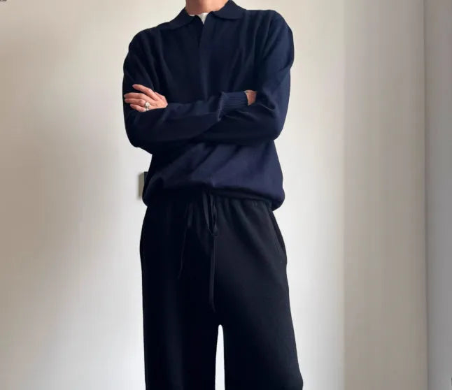 Pure wool polo sweater with a lapel collar in navy blue, shown in a loose fit on a model.