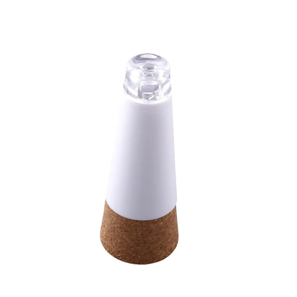 White rechargeable LED bottle cap cork light with plastic shell for holiday decoration.