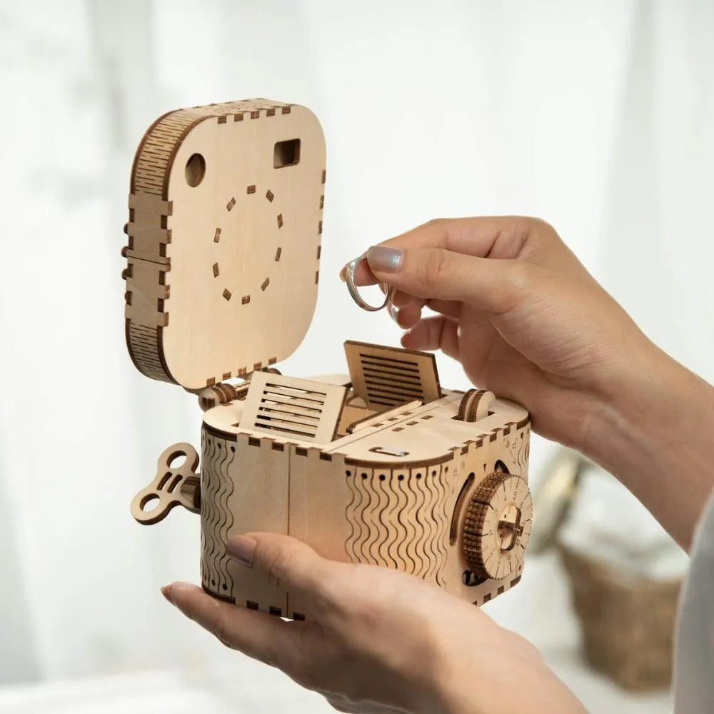 Wooden three-dimensional puzzle film projector with hand crank and gear wheel assembly