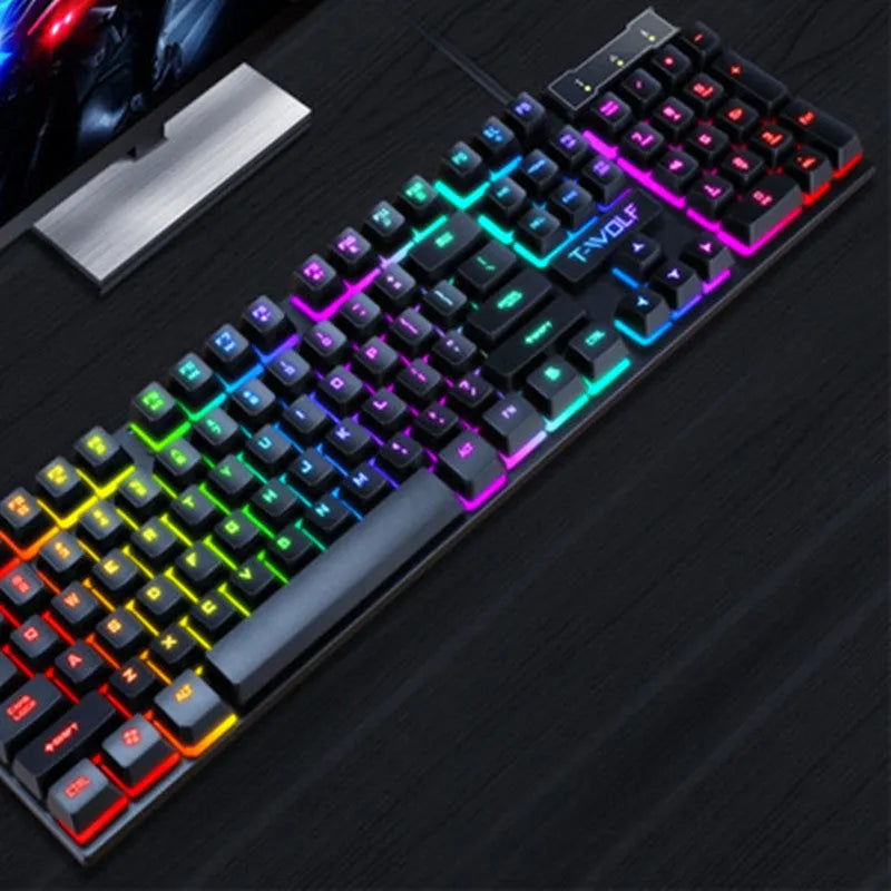 USB wired gaming keyboard with floating keycaps and colourful backlight showing multimedia shortcut keys