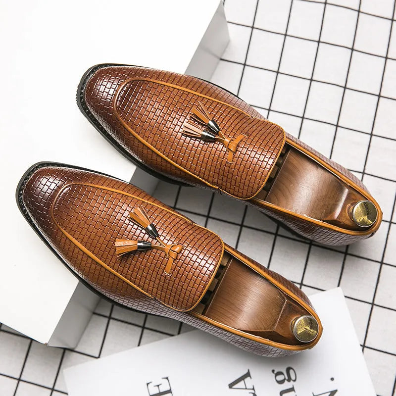 Men's black formal slip-on shoe with pointed toe and decorative tassel on artificial PU upper.