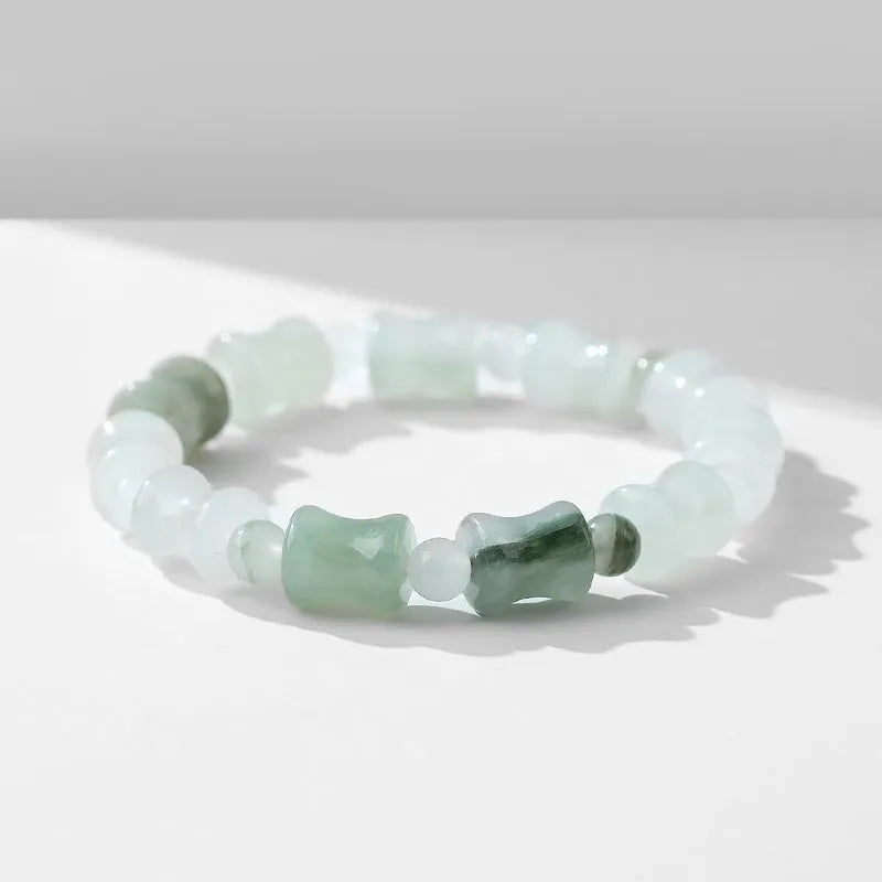 Natural chalcedony beaded bracelet with safety lock closure and diamond-shaped jade beads on elastic string