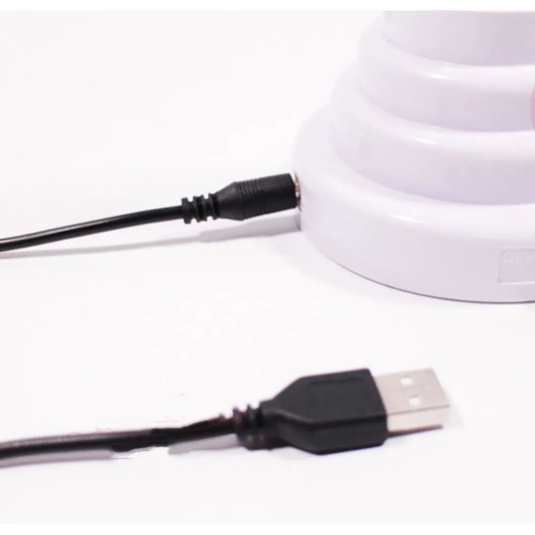 Minimalist bamboo-shaped desktop lamp with USB cable and green illumination