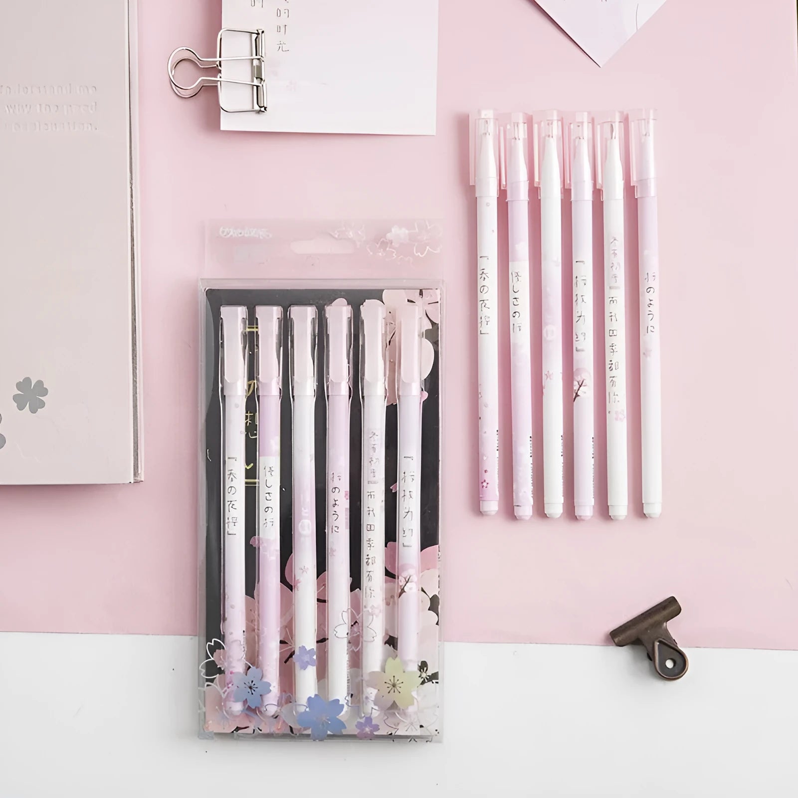 Six black Creative Sakura gel pens with 0.5mm needle tube refills arranged together
