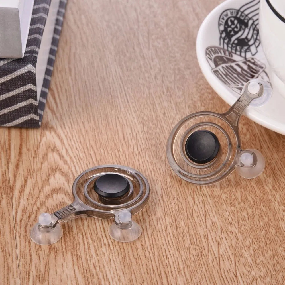 Clear and black universal mini joystick for mobile phone touch screen gaming.