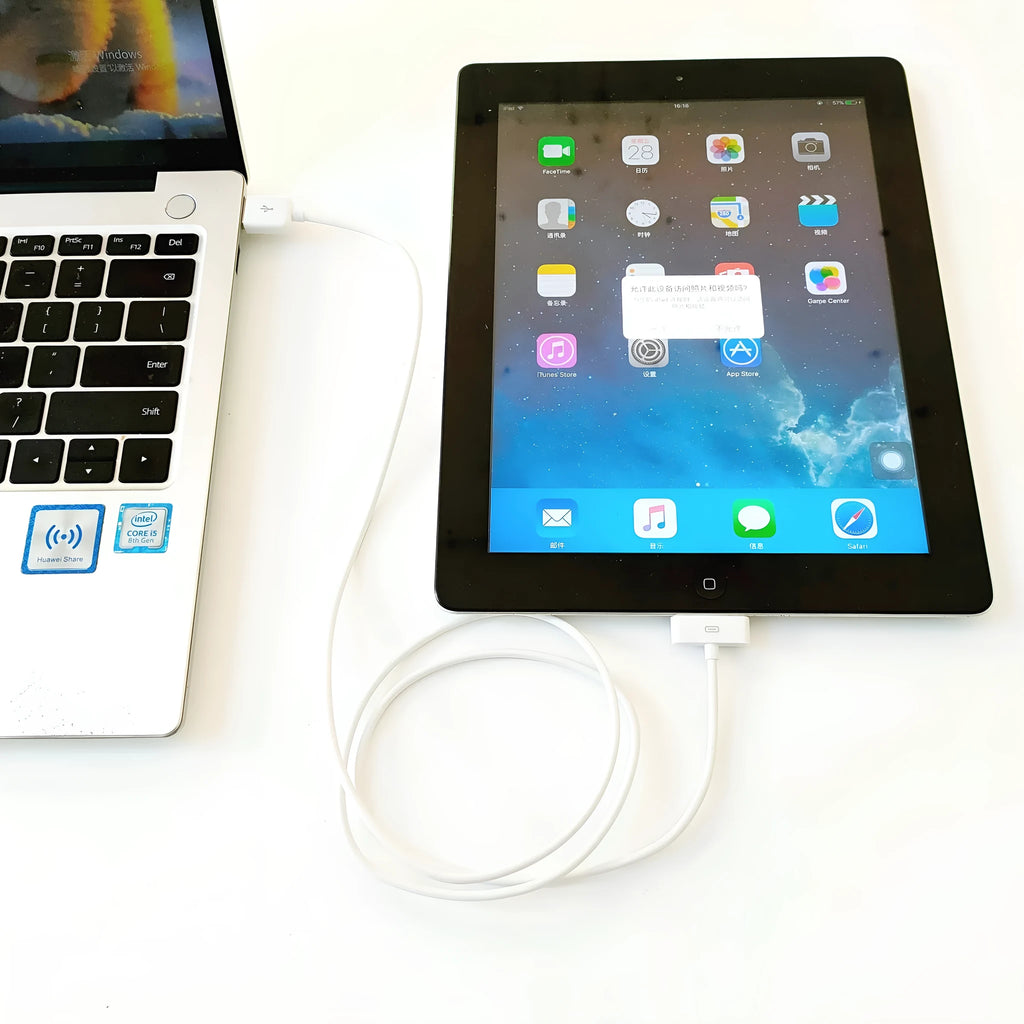 Black 1 metre data and charging cable for tablet on white background