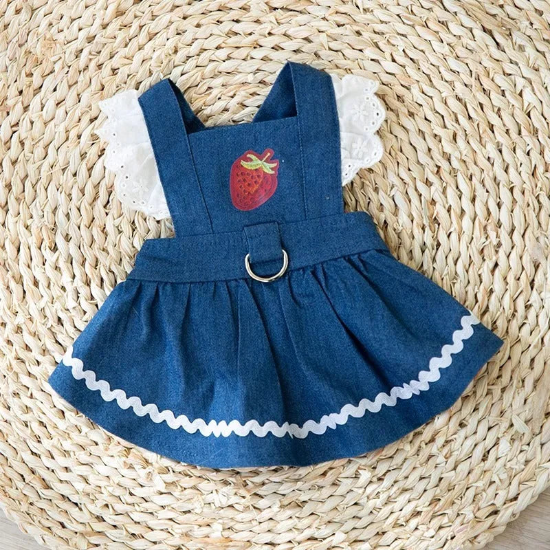 Bondi Blue dog skirt with strawberry and denim print on a small dog model.