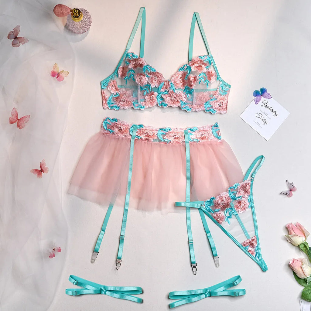 Pink women's mesh pettiskirt bikini set with embroidery detail on polyester fabric.