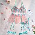 Pink women's mesh pettiskirt bikini set with embroidery detail on polyester fabric.