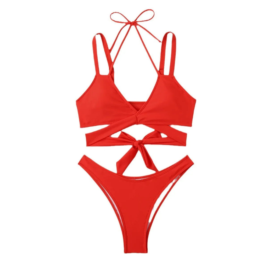 Women's solid colour strap bikini swimsuit on a hanger, shown in red.