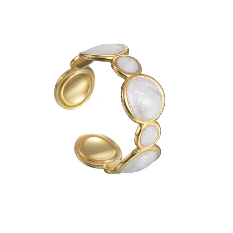 A geometric stainless steel ring for women with an adjustable opening and electroplated finish.
