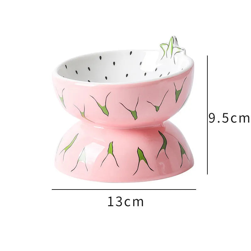 Orange patterned ceramic raised cat bowl on a tilted stand for food and water.