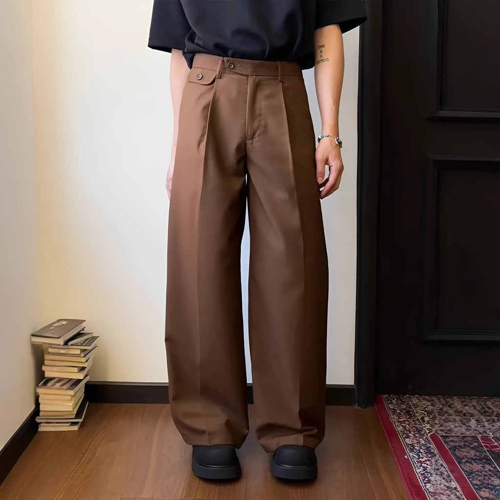 Men's straight-leg wide-leg casual trousers in black, showing loose fit and draping fabric.