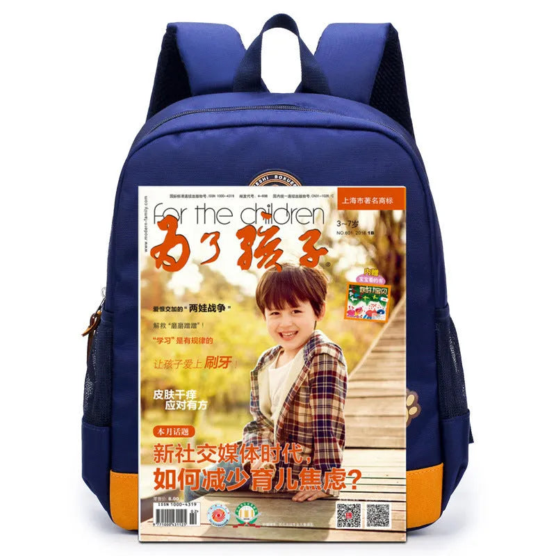 Blue nursery backpack with a cartoon bear design, showing front zip pocket and adjustable padded straps.