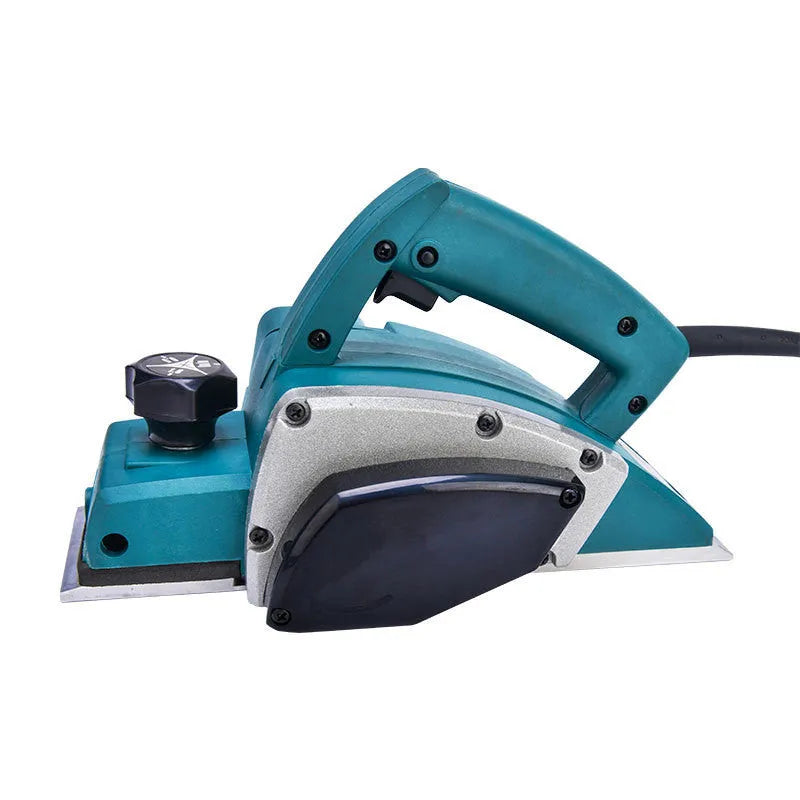 Red aluminium electric wood planer with 82mm width on workbench