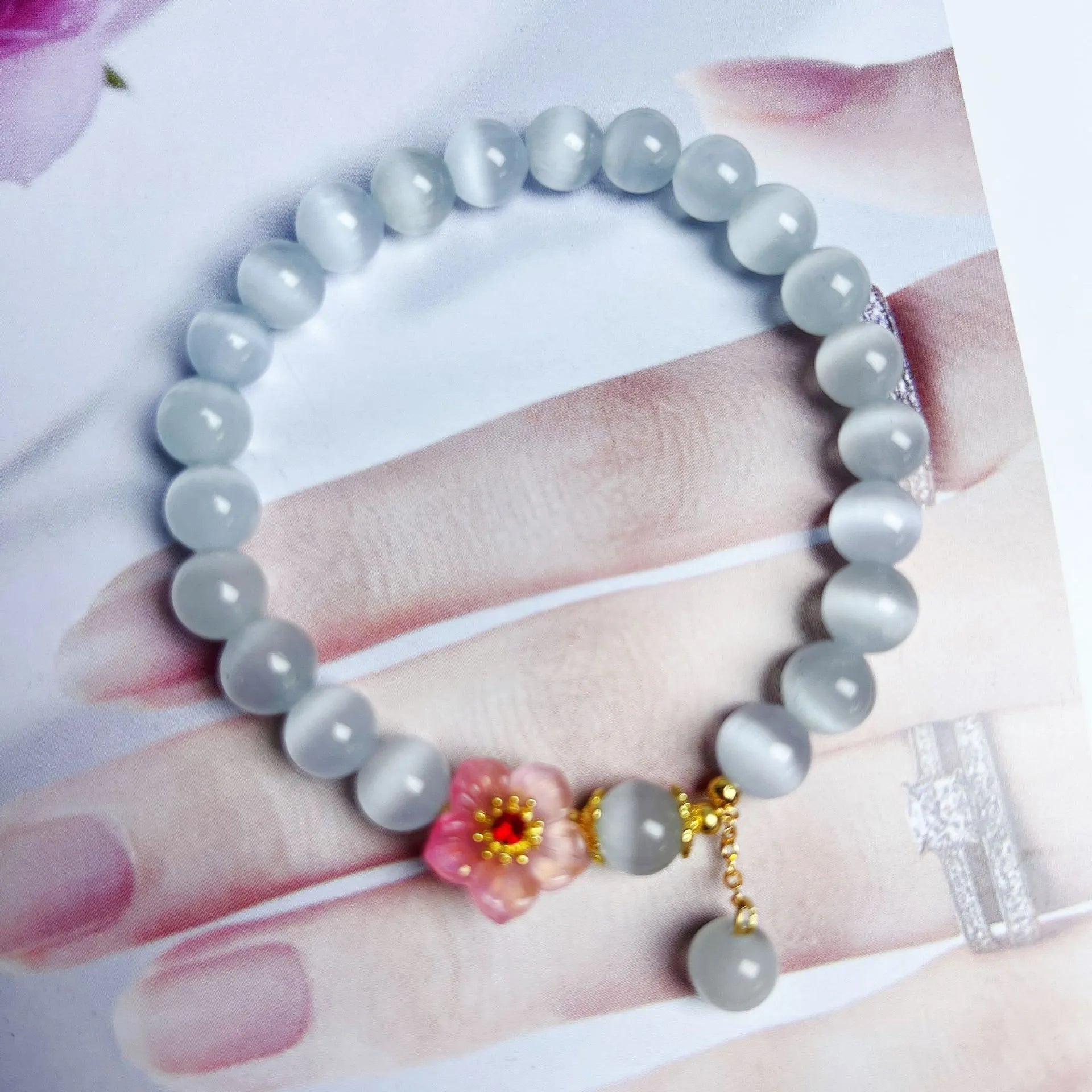 White opal flower beaded bracelet with colourful glaze accents on glass beads.