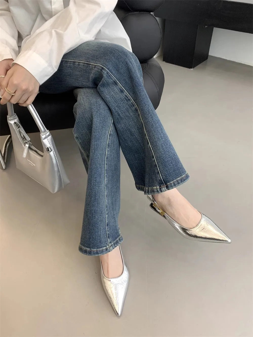 Women's black leather low heel strap shoes with pointed toe and thin rubber soles