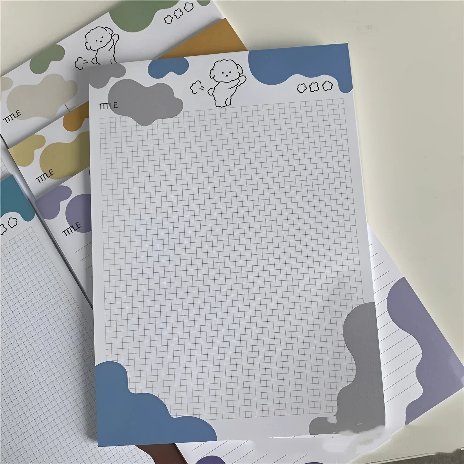 INS Wind Marshmallow Dog B5 sticky note paper pad showing colourful puppy cover designs.