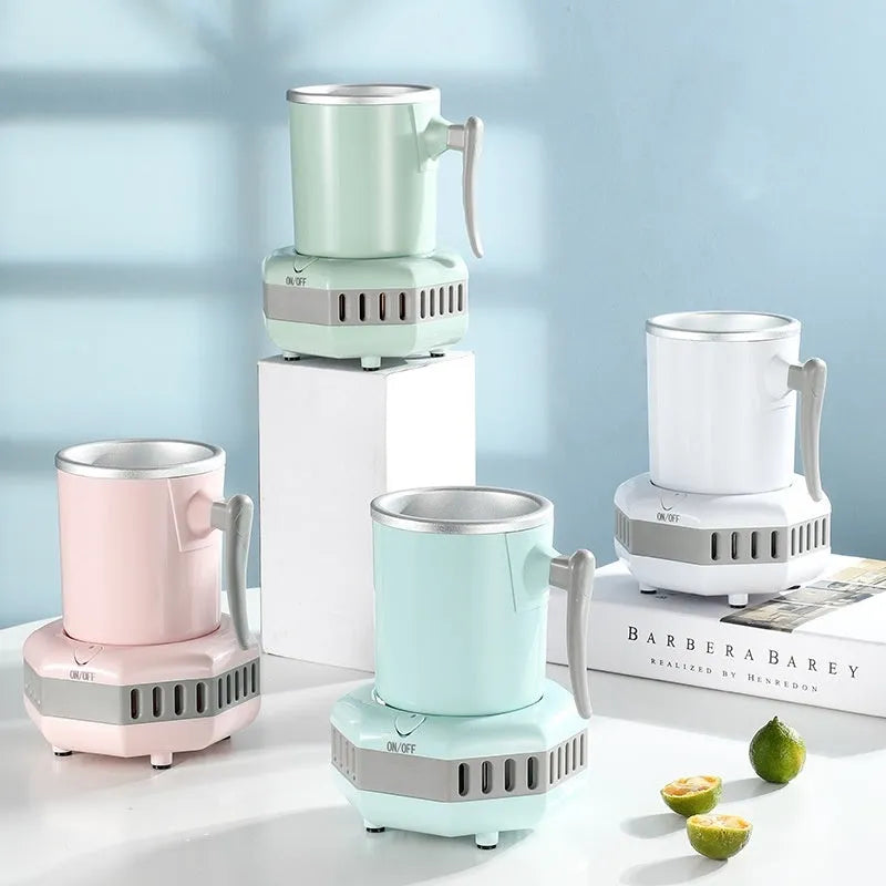 White mini quick cooling cup with aluminium drinking vessel and electronic base on a desk.