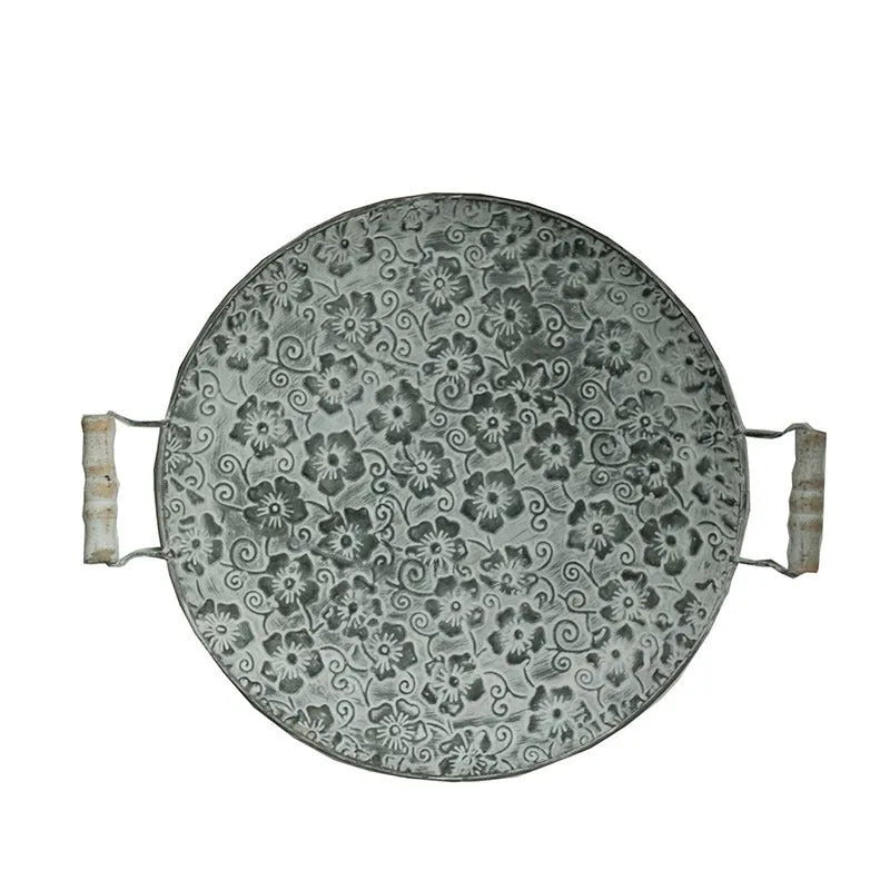 Round wrought iron storage tray in two sizes for organising jewellery or food on a countertop.