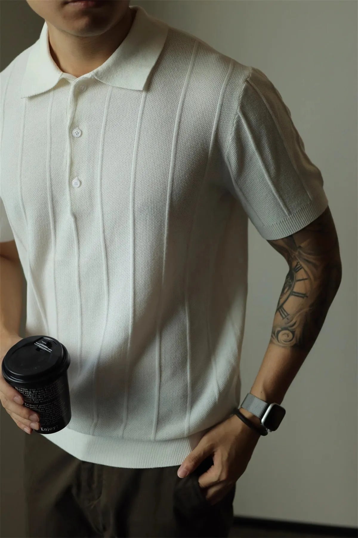 Men's solid colour polyester t-shirt in loose fit, available in black and white options