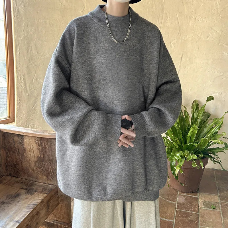 Men's loose fit round neck pullover sweater in a solid colour on a hanger.