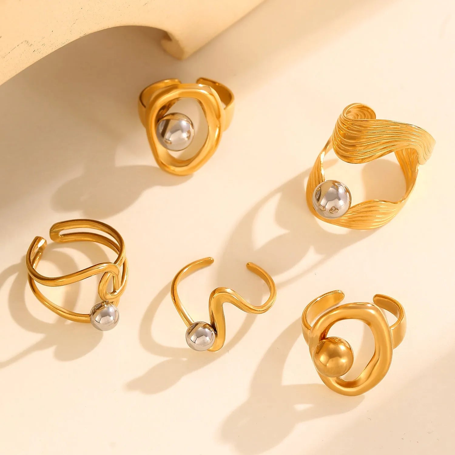 Geometric hollow line open ring in 304 stainless steel with 18K real gold finish, ellipse design