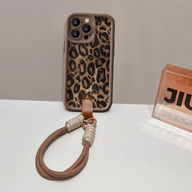 Brown leopard print silicone phone case with a detachable lanyard for an iPhone.