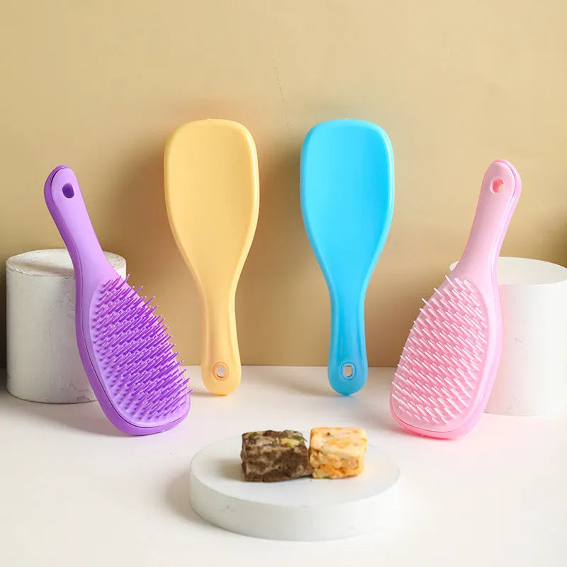TT Air Curling Massage Home Princess Comb in pink, a plastic air-cushion hairbrush with massage tips