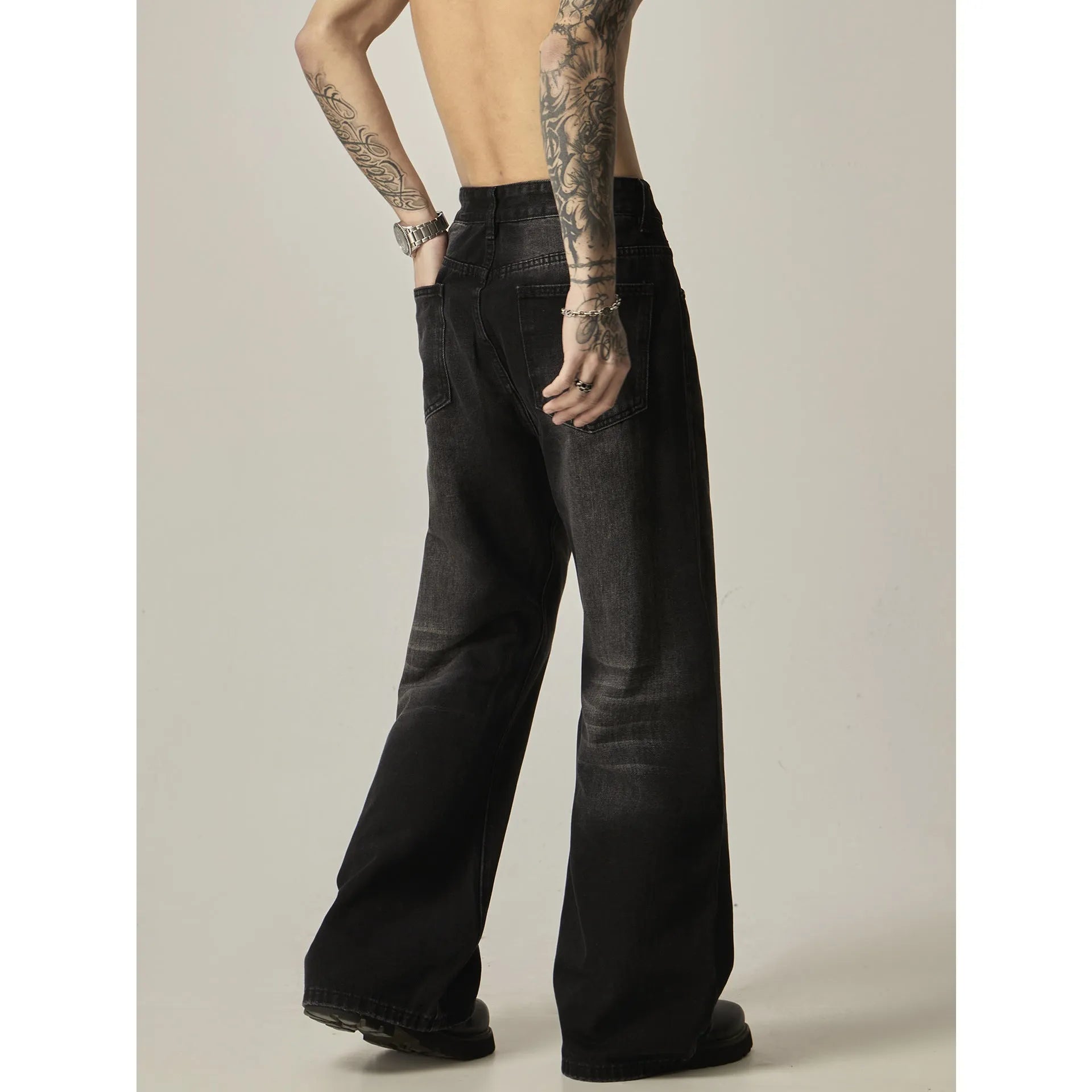Black loose straight retro jeans showing front and back views with five-pocket design