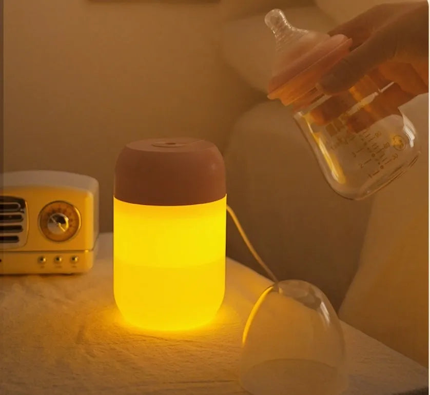 Small white cylindrical USB mini humidifier for desk or bedside use.