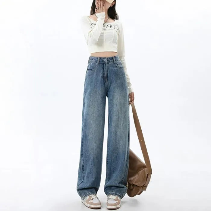 Retro blue women's wide leg jeans with a high waist and straight leg on a hanger