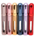 Slim 12ml aluminium travel perfume bottle with glass liner in blue, gold, pink, red, silver, and violet colours.