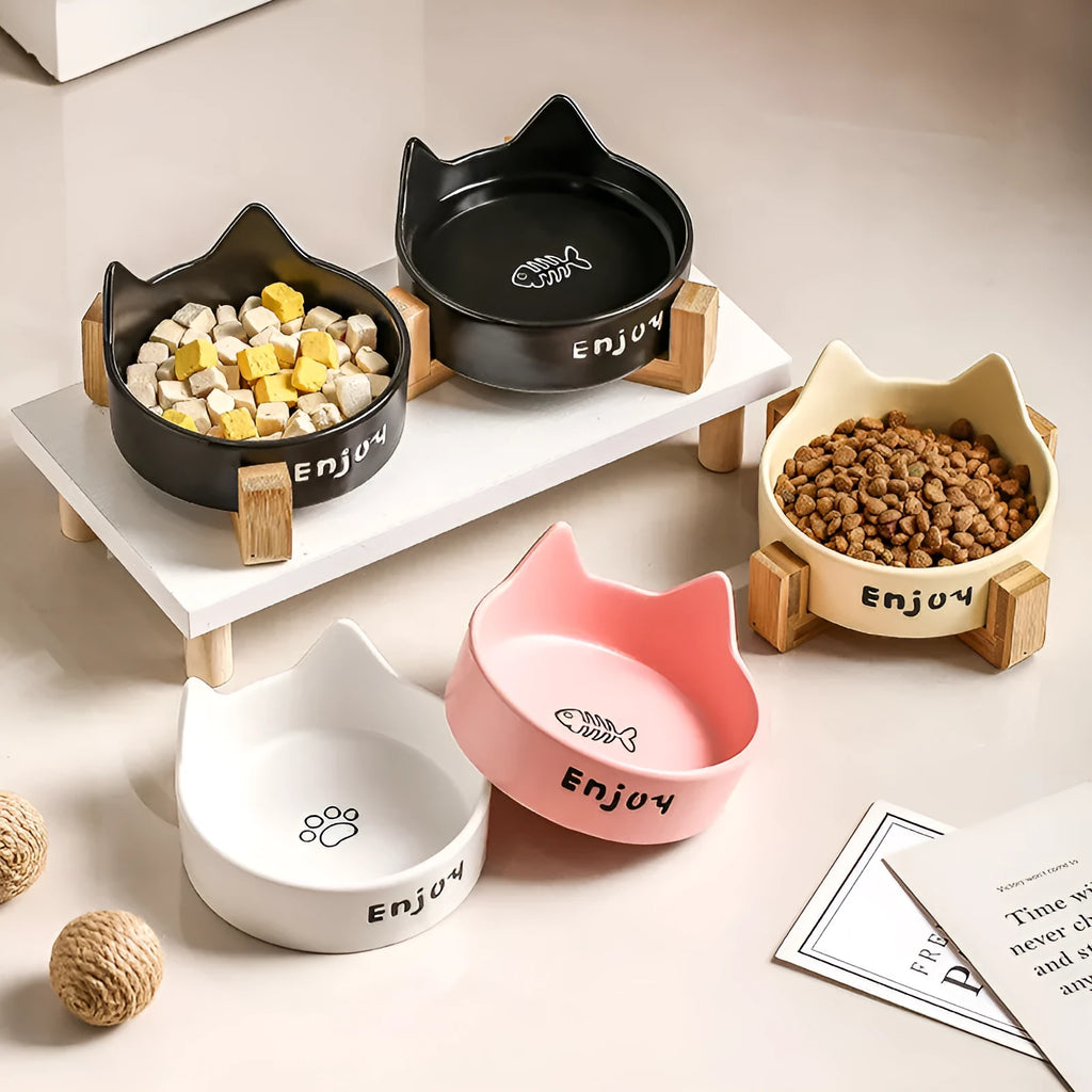 Porcelain cat food and water bowl set with wooden anti-slide frame in a choice of colours and patterns.