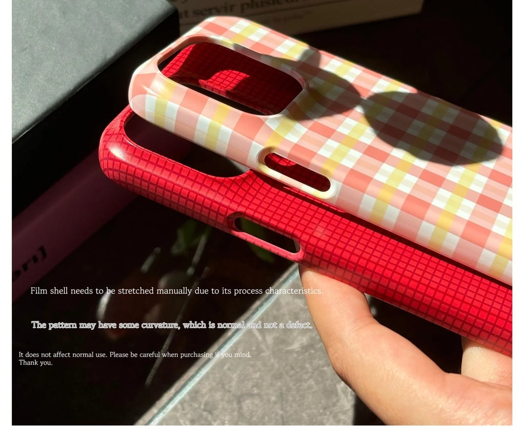 iPhone 15 Pro Max phone case with plaid design in red or orange grid pattern