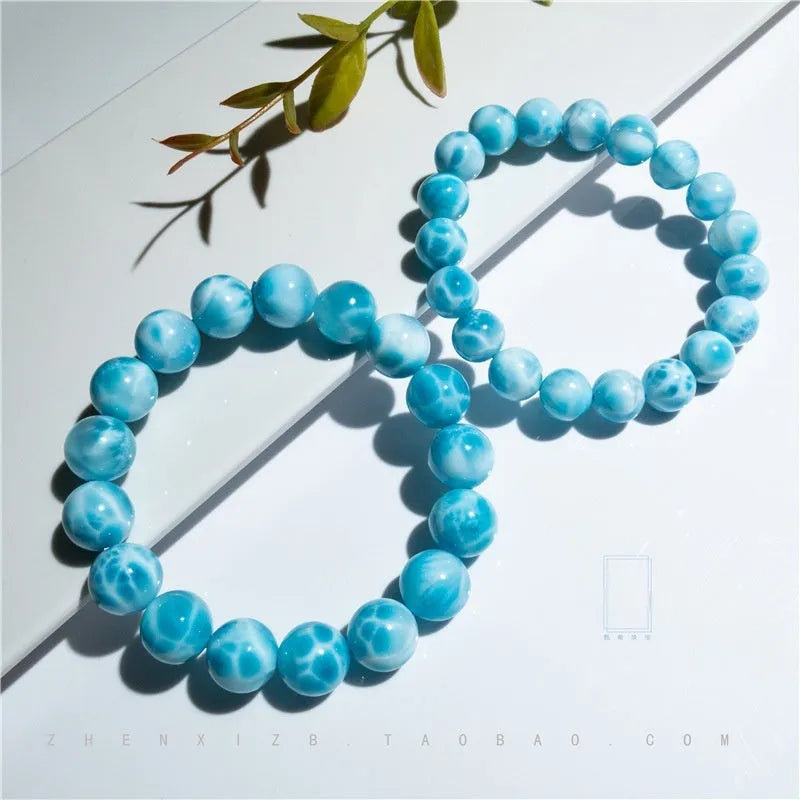 Blue handmade Bodhi bracelet with natural crystal stones and pearl accents in Maillard style.