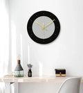 Transparent tempered glass minimalist wall clock with silent movement on a white wall.