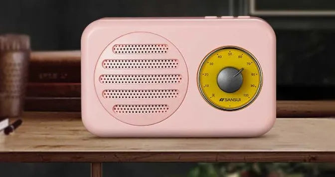 Compact portable Bluetooth speaker in wood colour finish with FM radio and USB cable.