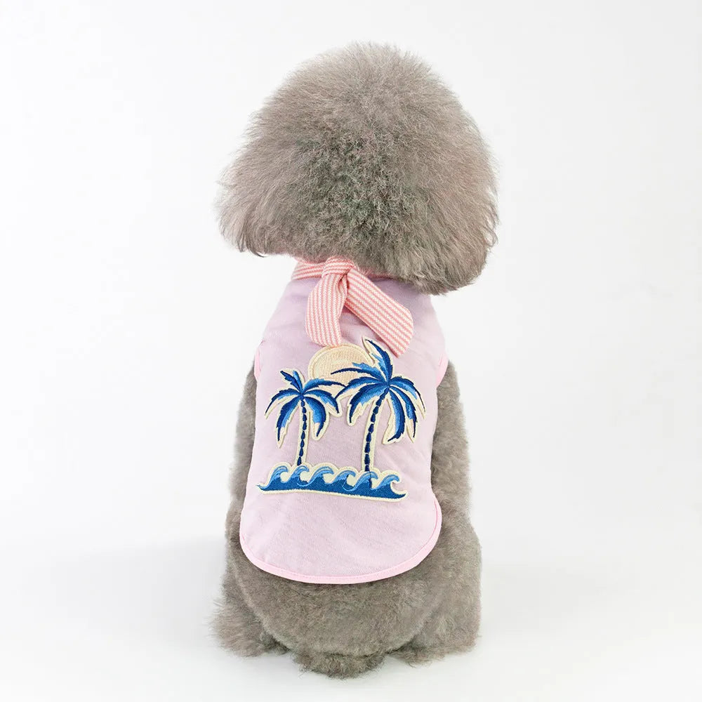 Pink cotton dog coat with coconut tree embroidery on a white background, size M shown