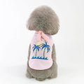Pink cotton dog coat with coconut tree embroidery on a white background, size M shown