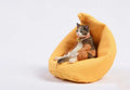 Small lazy cat car ornament with fabric sofa, 75mm high dashboard decoration.