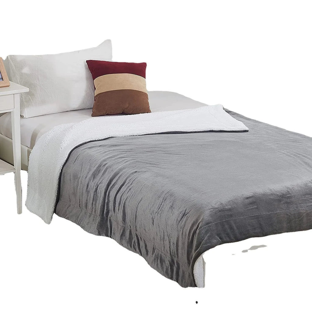 Grey and white flannel electric heating blanket with USB cable and temperature controls.