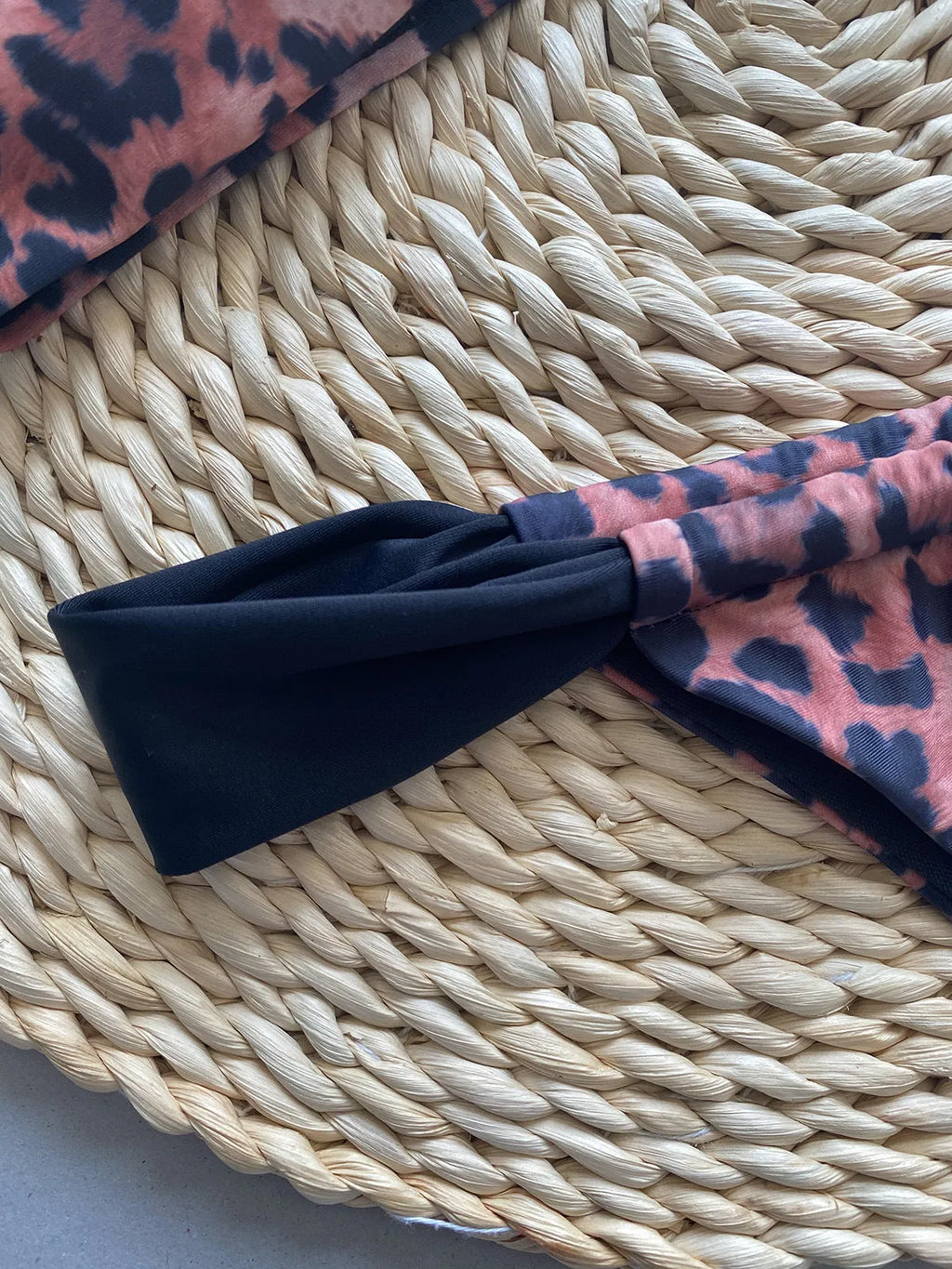 Women's leopard print bikini set with sleeveless tube top and matching swimsuit bottoms.