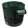 Dark green PE garden planting bag with side windows and double handles on a balcony