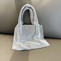 Silver cotton thread party handbag with rhinestone detailing and open outer pocket