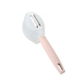Stainless steel fruit peeler with pink plastic PP handle on light background