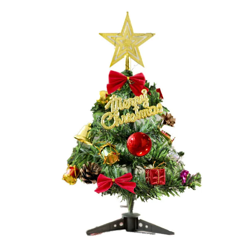 Mini Christmas tree 30cm tall in PVC, colour A, on a tabletop with festive background