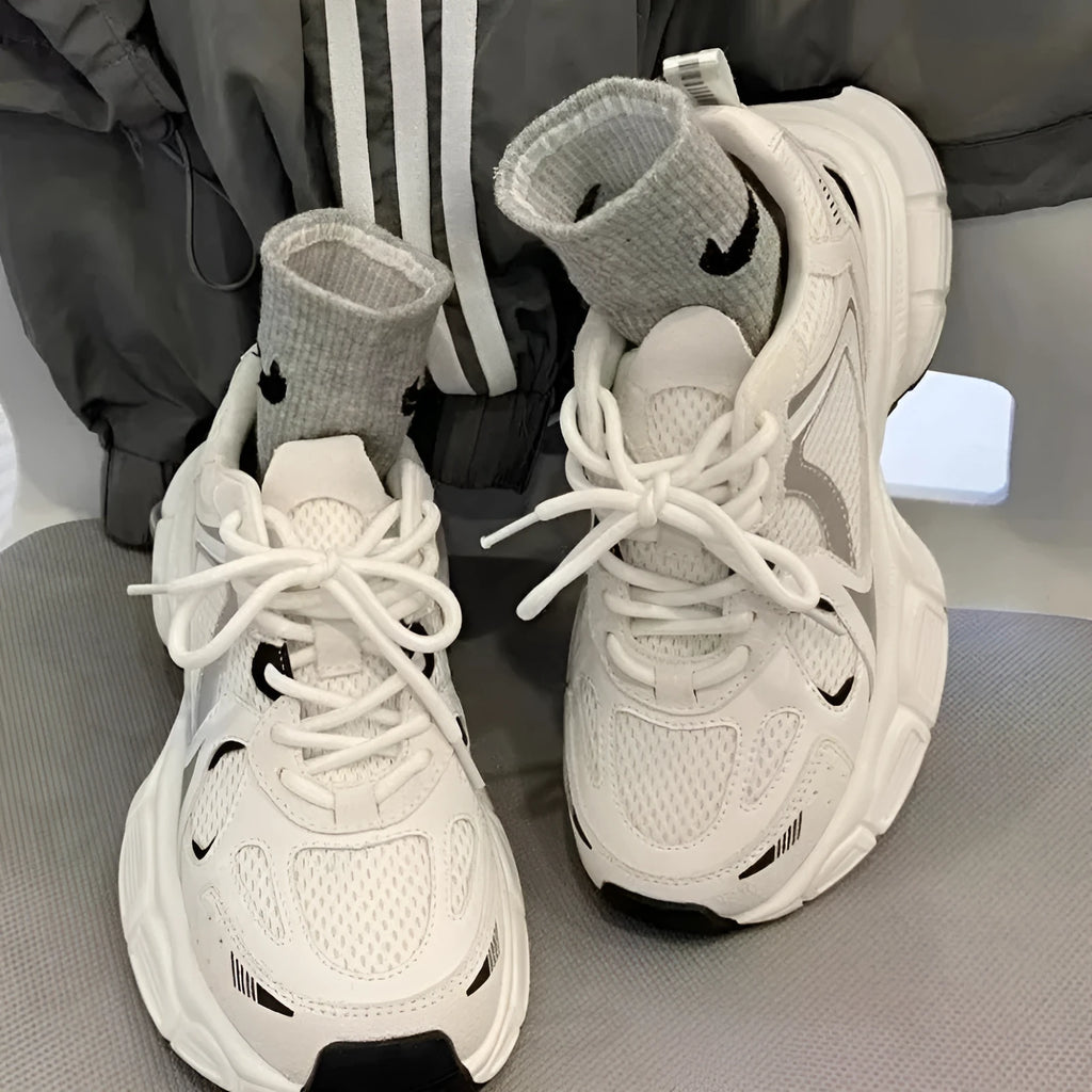 Beige mesh platform sports shoes with wedge heel, front lace-up design, and rubber sole